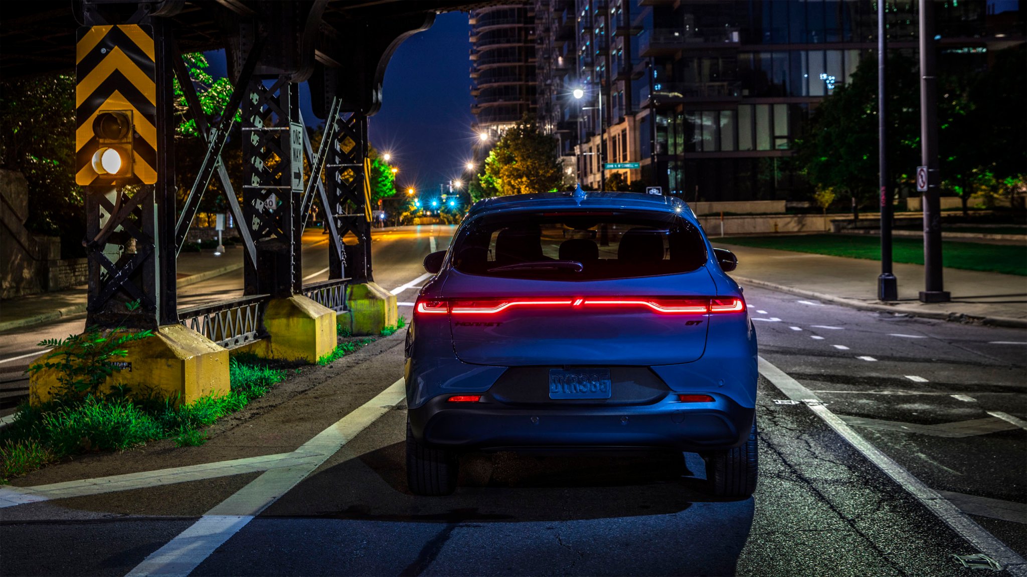 2025 Dodge Hornet rear view, lights on, at night