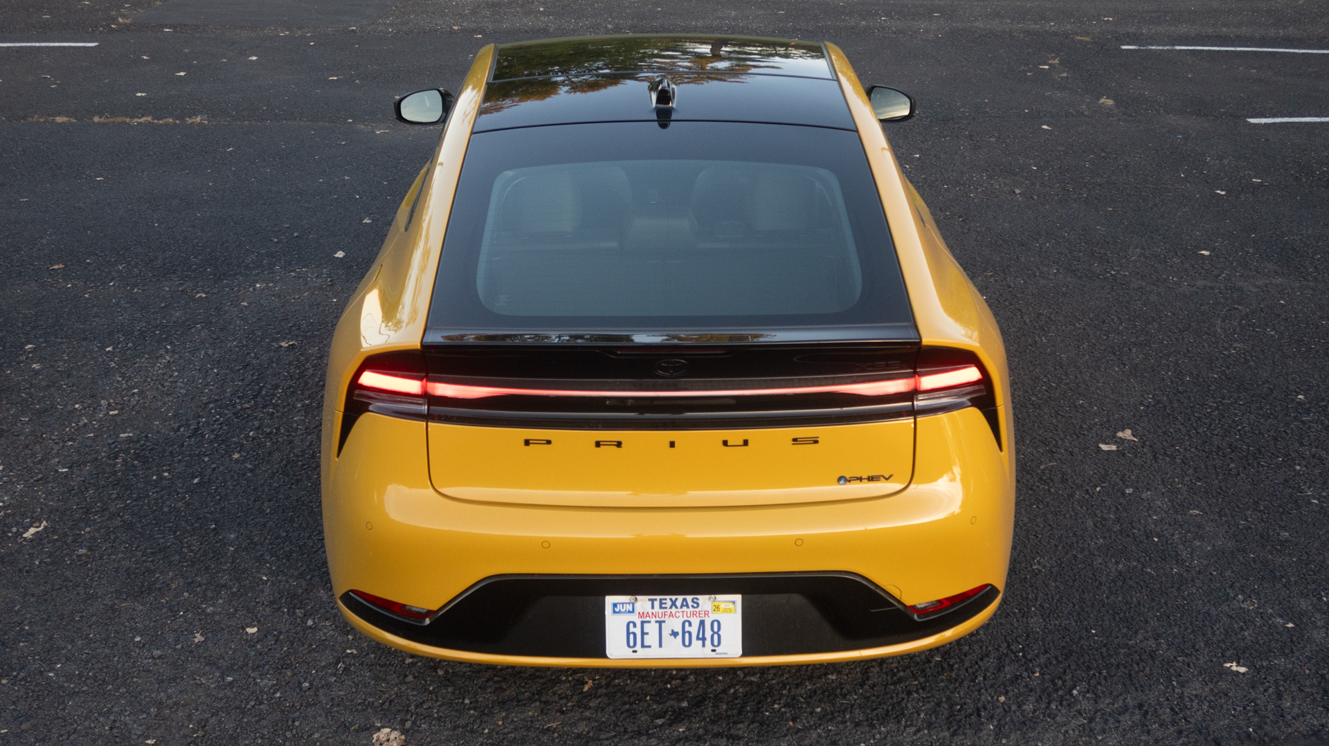 Yellow Prius from the back,