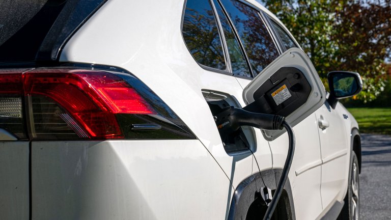 A 2021 Toyota RAV4 Prime electric car is recharged October 3, 2022 at a charging station at the town hall in Charlotte, Vermont