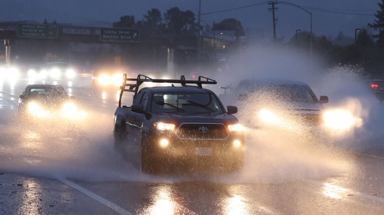 GREENBRAE, CALIFORNIA - JANUARY 04: Cars drive along Highway 101 as rain falls on January 04, 2023 in Greenbrae, California