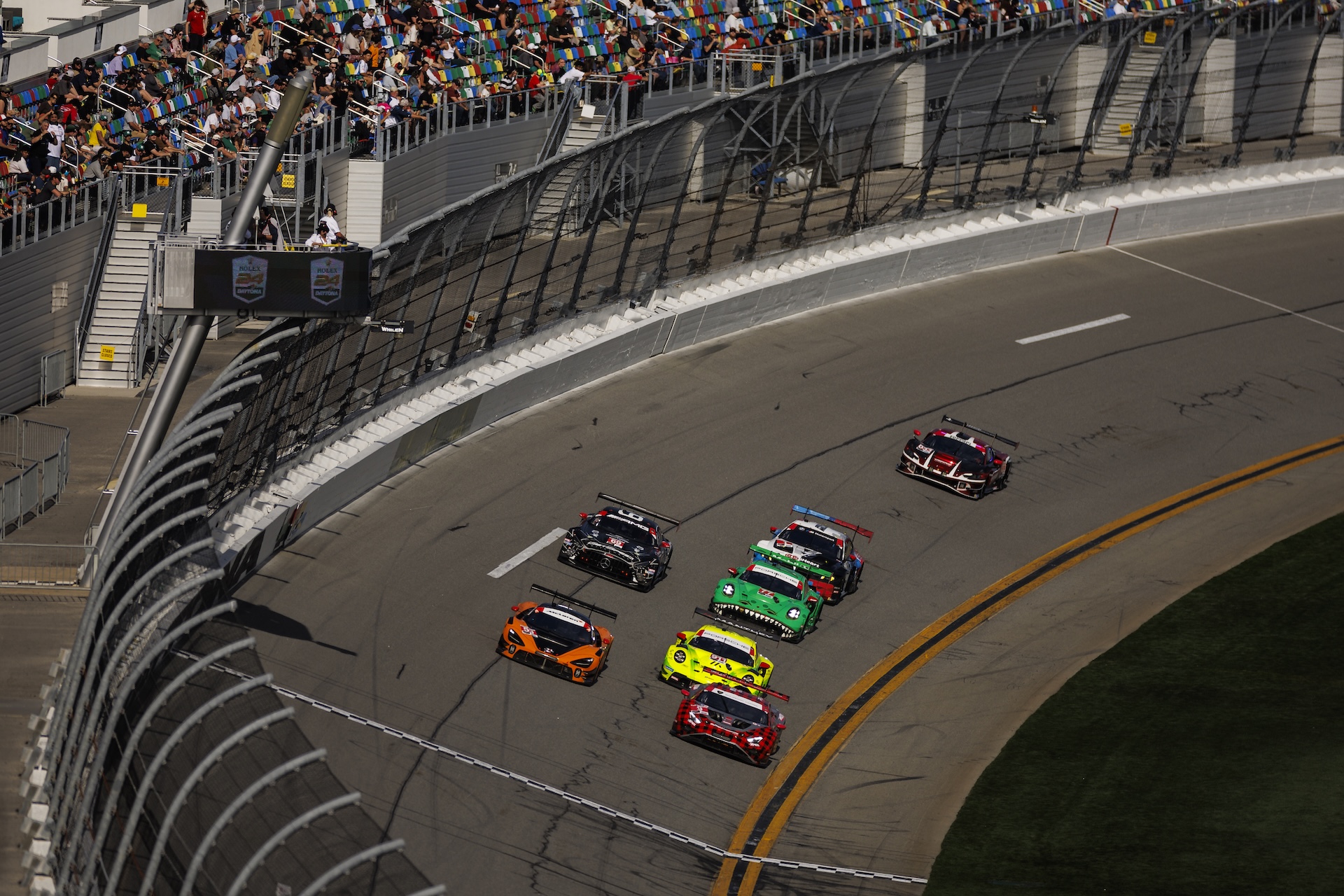 DAYTONA BEACH, FLORIDA - JANUARY 24: The The #9 Pfaff Motorsports Lamborghini Huracan GT3 EVO2 GTD Pro of Andrea Caldarelli, Sandy Mitchell, Mirko Bortolotti, James Hinchcliffe and The #59 RLL Team McLaren McLaren 720S GT3 EVO GTD Pro of Max Esterson, Nikita Johnson, Juri Vips, Dean MacDonald race during the Rolex 24 at Daytona International Speedway on January 24, 2026 in Daytona Beach, Florida. (Photo by James Gilbert/Getty Images)