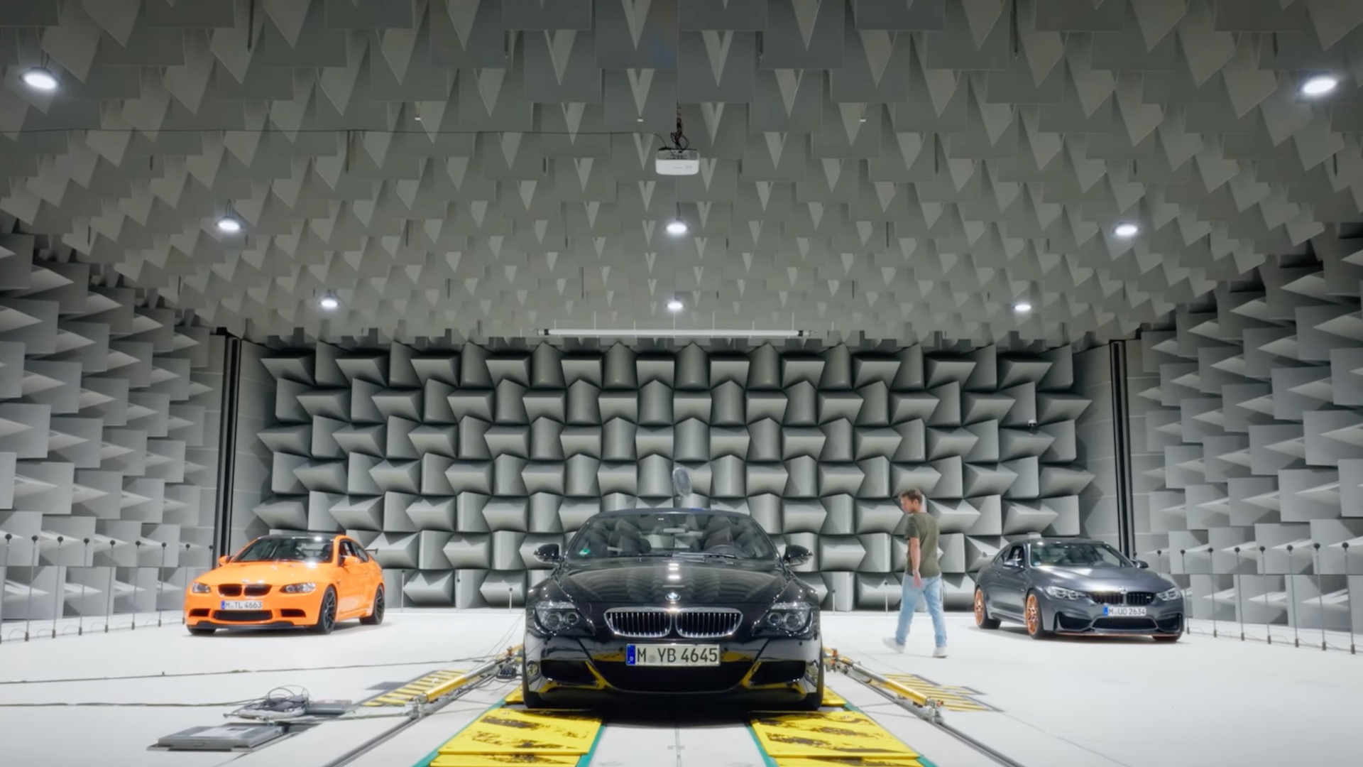 Trio of BMW M cars in a soundproof room.