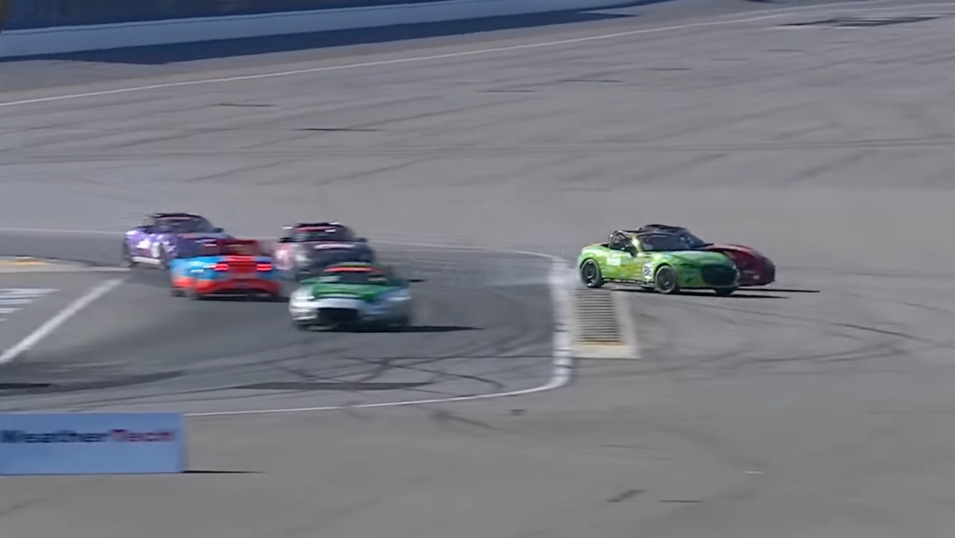 Mazda MX-5 Cup cars in Chick Hicks and Lightning McQueen liveries collide.