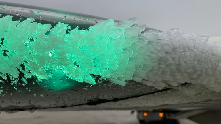 Ice buildup on the wind of a commercial airplane.