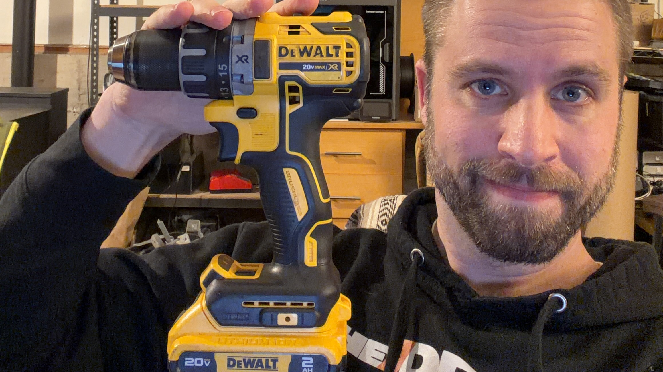 Editor holding a DeWalt drill.