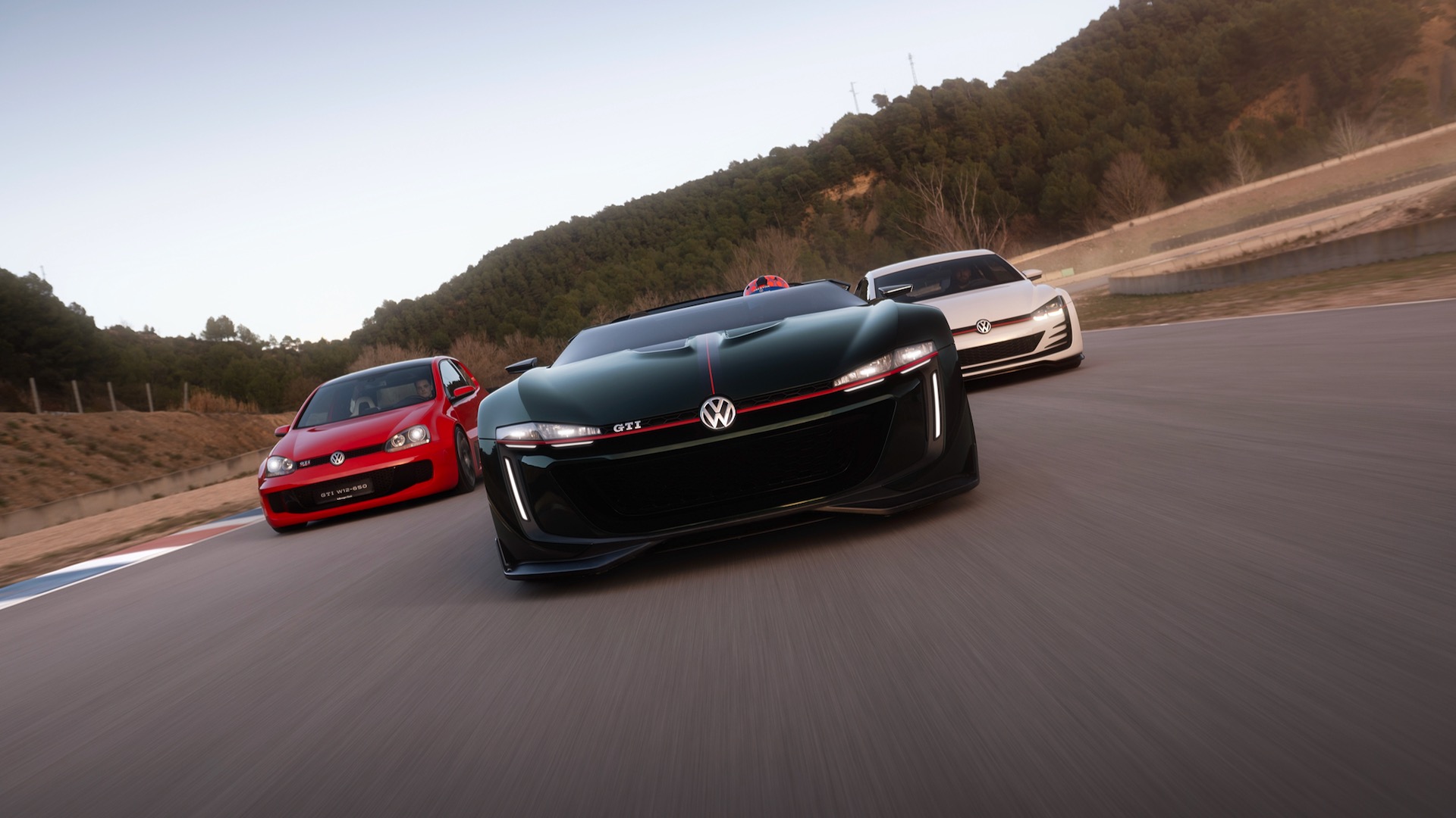 VW GTI Roadster concept flanked by GTI W12-650 (left) and Design Vision GTI (right).