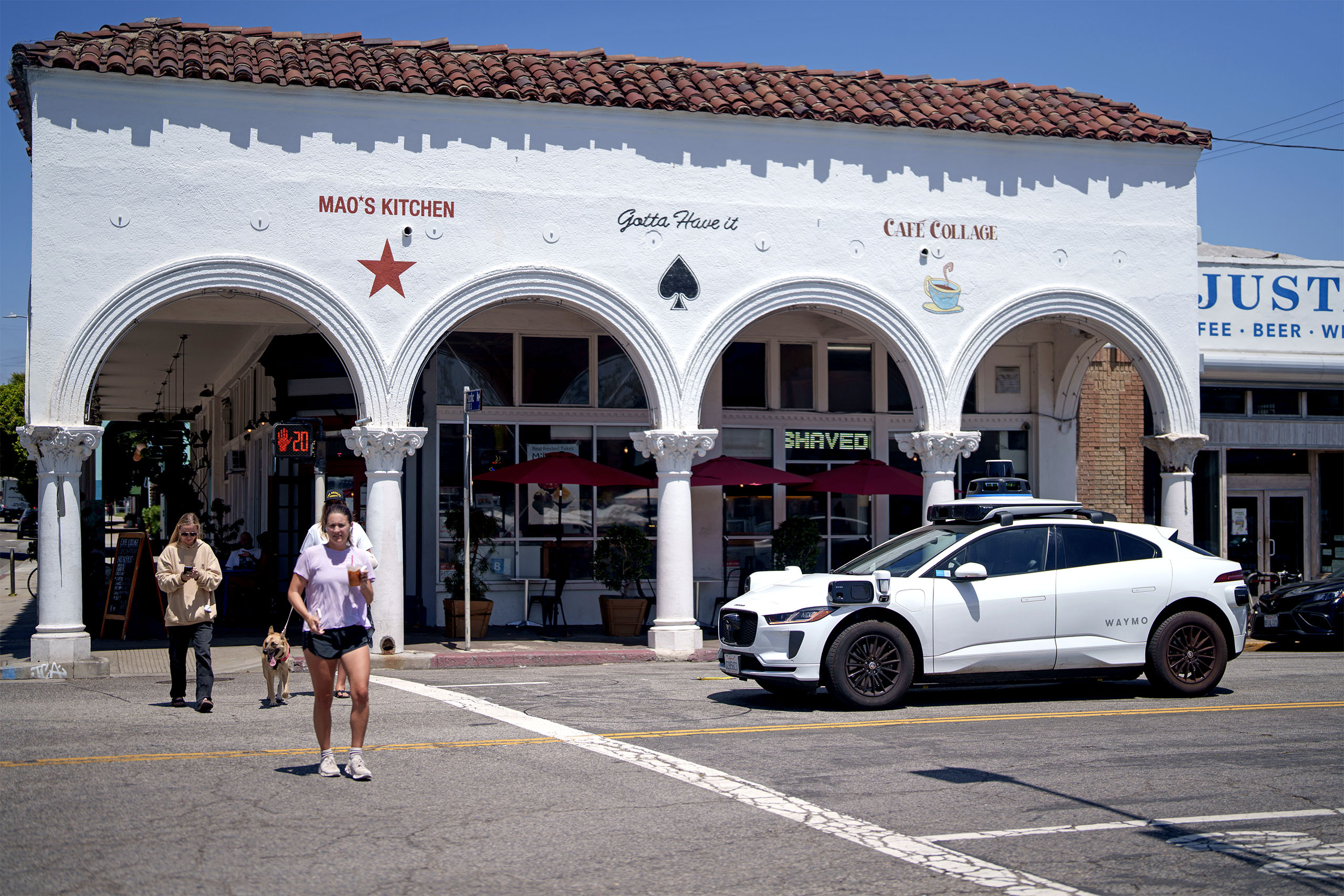 A Waymo vehicle stops at an intersection on May 14, 2025 in Los Angeles, California.