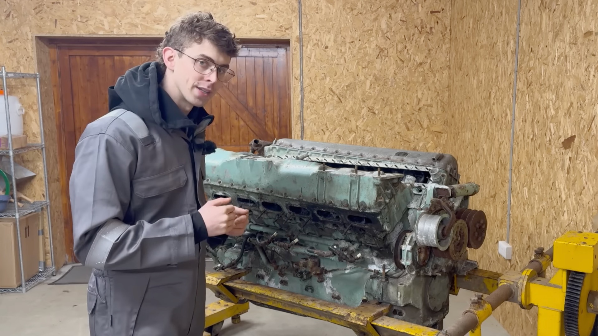 YouTuber Scott Nagle standing in front of a Rolls-Royce Meteor engine.