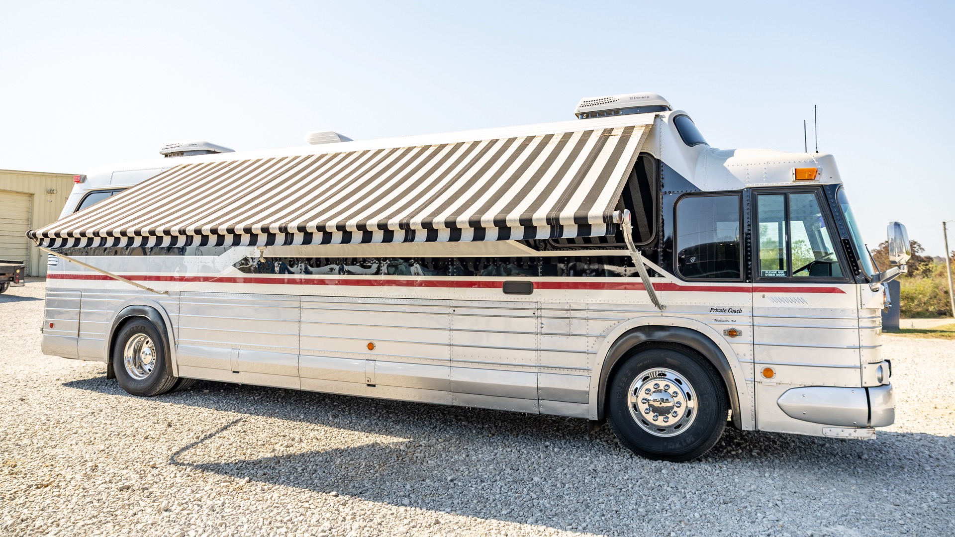 1970 GM bus RV awning out.