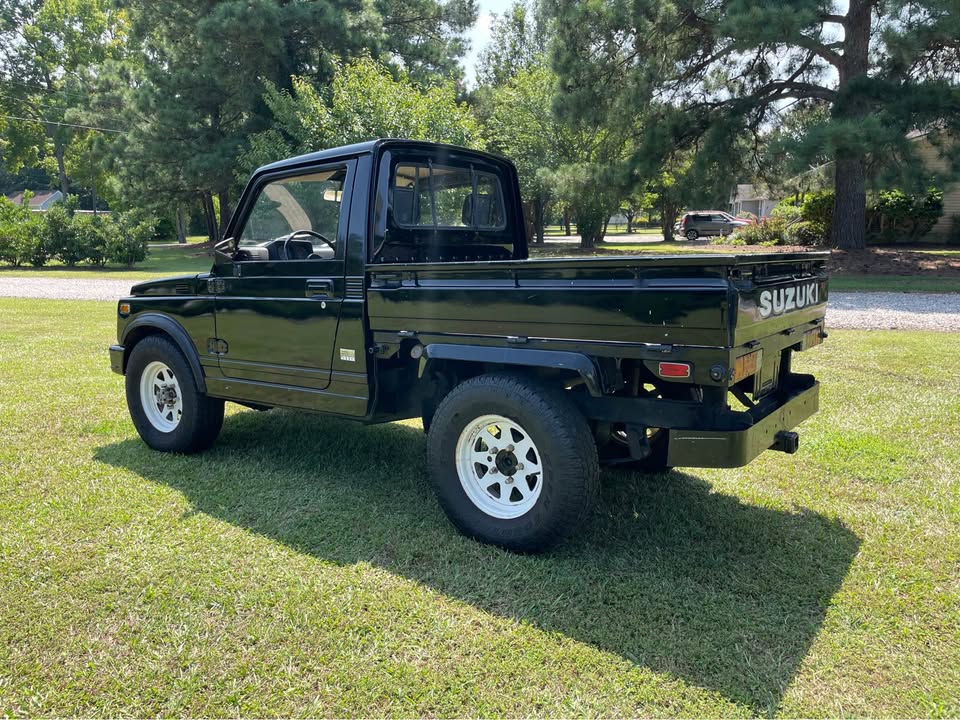 1982 Suzuki SJ410K pickup rear quarter view.