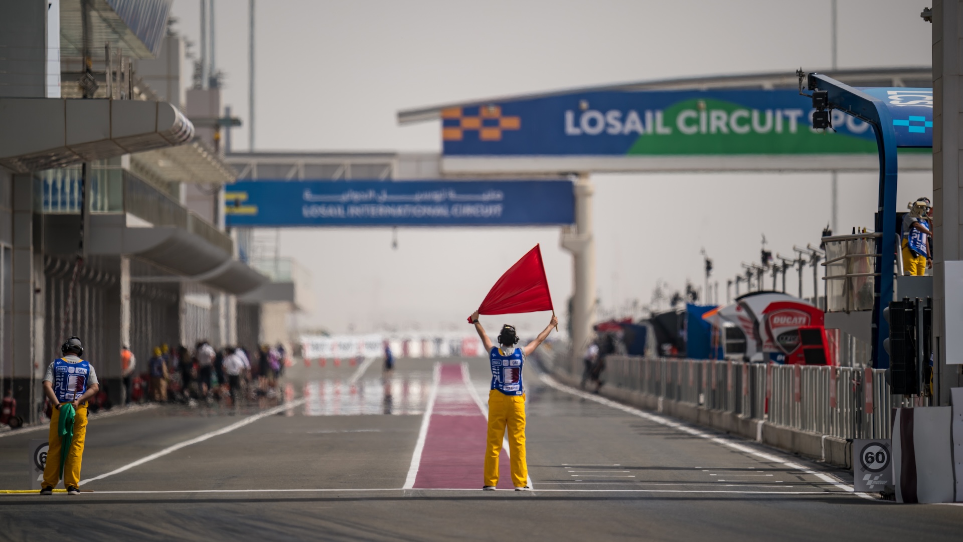 DOHA, QATAR - APRIL 02: Pitlane marshal with red flag before start the first free practice at Losail Circuit on April 02, 2021 in Doha, Qatar. (Photo by Steve Wobser/Getty Images)