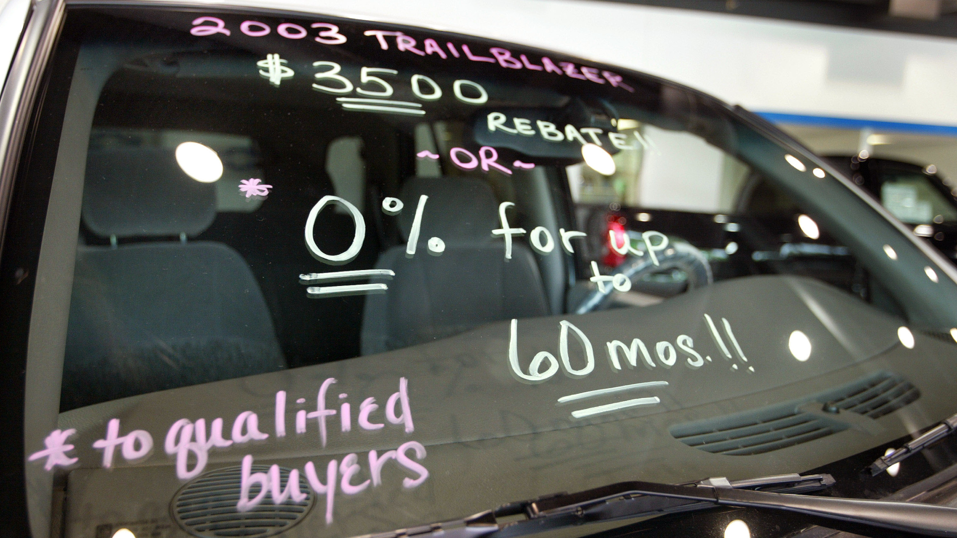 ELK GROVE VILLAGE, IL - JUNE 2: Sales incentives are shown on the window of a 2003 Chevrolet Trailblazer in the showroom of Hoskins Chevrolet June 2, 2003 in Elk Grove Village, Illinois. Auto dealers are looking to increase sales with incentives for car buyers to try and help disappointing sales in May. (Photo by Tim Boyle/Getty Images)