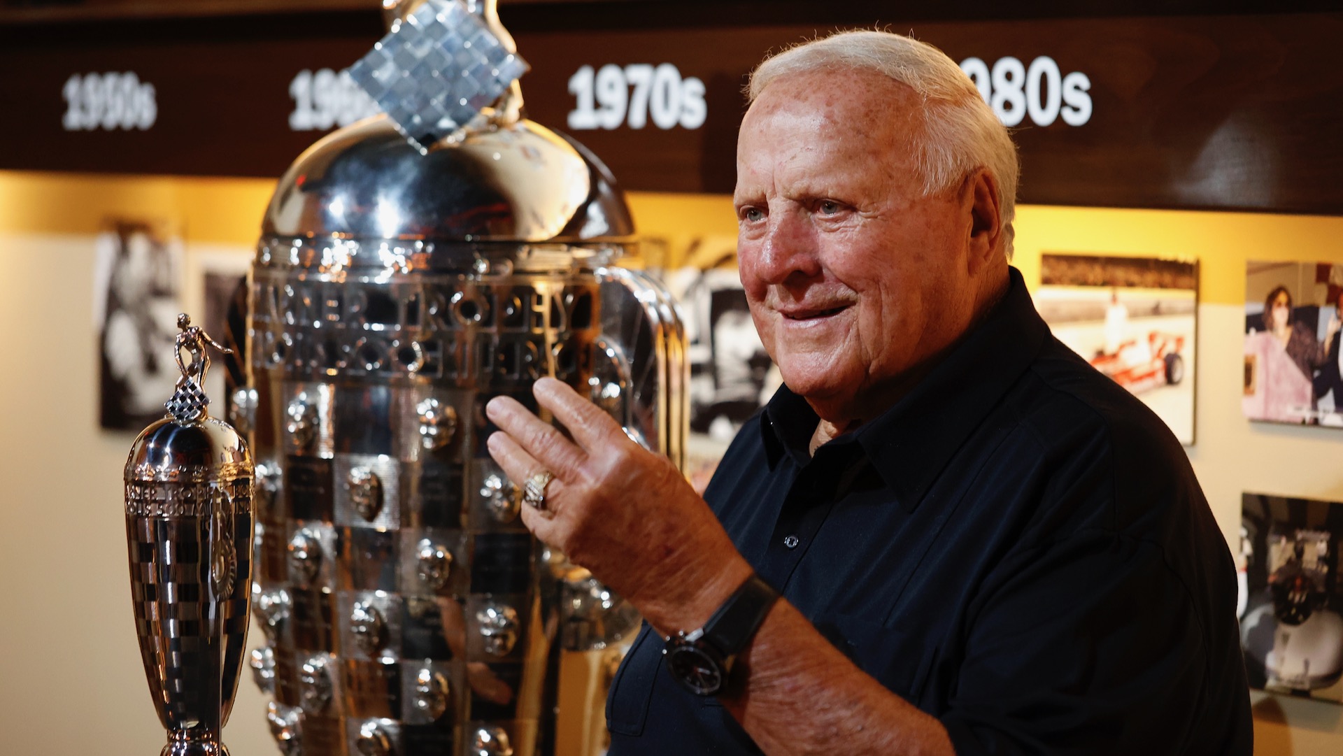 IndyCar legendary driver A.J. Foyt poses for a photo after receiving a Baby Borg Trophy from Borg Warner to commemorate his four Indianapolis 500 wins from years 1961, 1964, 1967, and 1977 on May 17th, 2022 at the Foyt Wine Vault in Speedway, Indiana.