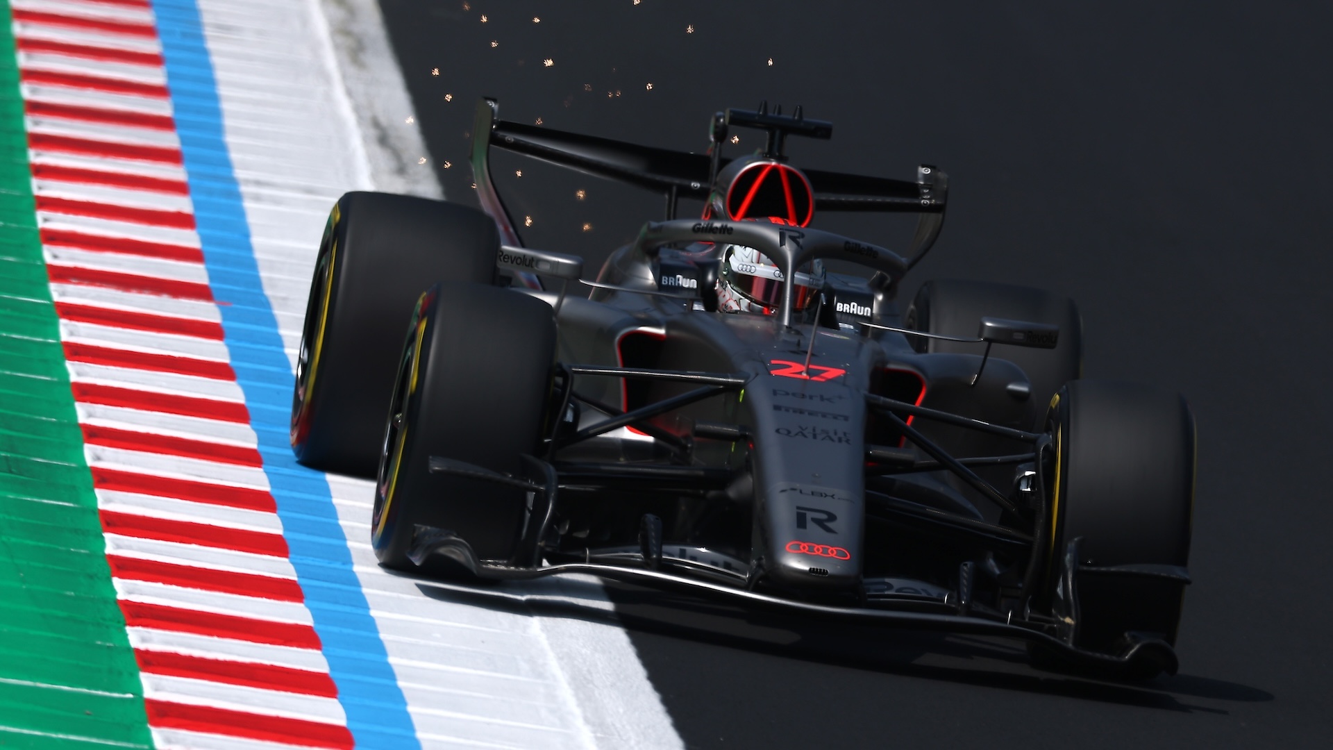 SUZUKA, JAPAN - MARCH 28: Sparks fly behind Nico Hulkenberg of Germany driving the (27) Audi F1 Team R26 on track during final practice ahead of the F1 Grand Prix of Japan at Suzuka Circuit on March 28, 2026 in Suzuka, Japan. (Photo by Clive Mason/Getty Images)