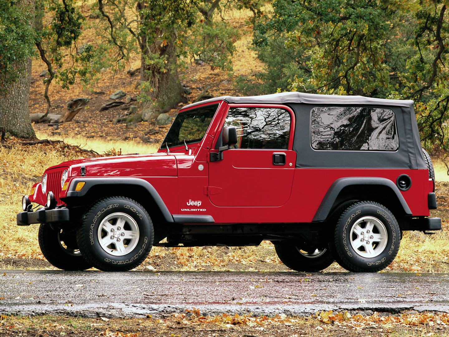 Jeep LJ with soft top on.