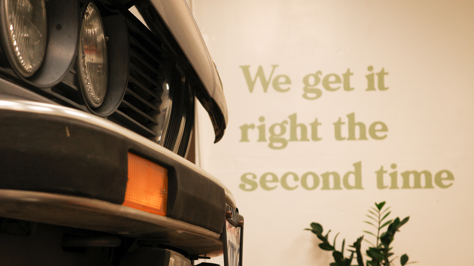 BMW parked inside an auto shop.