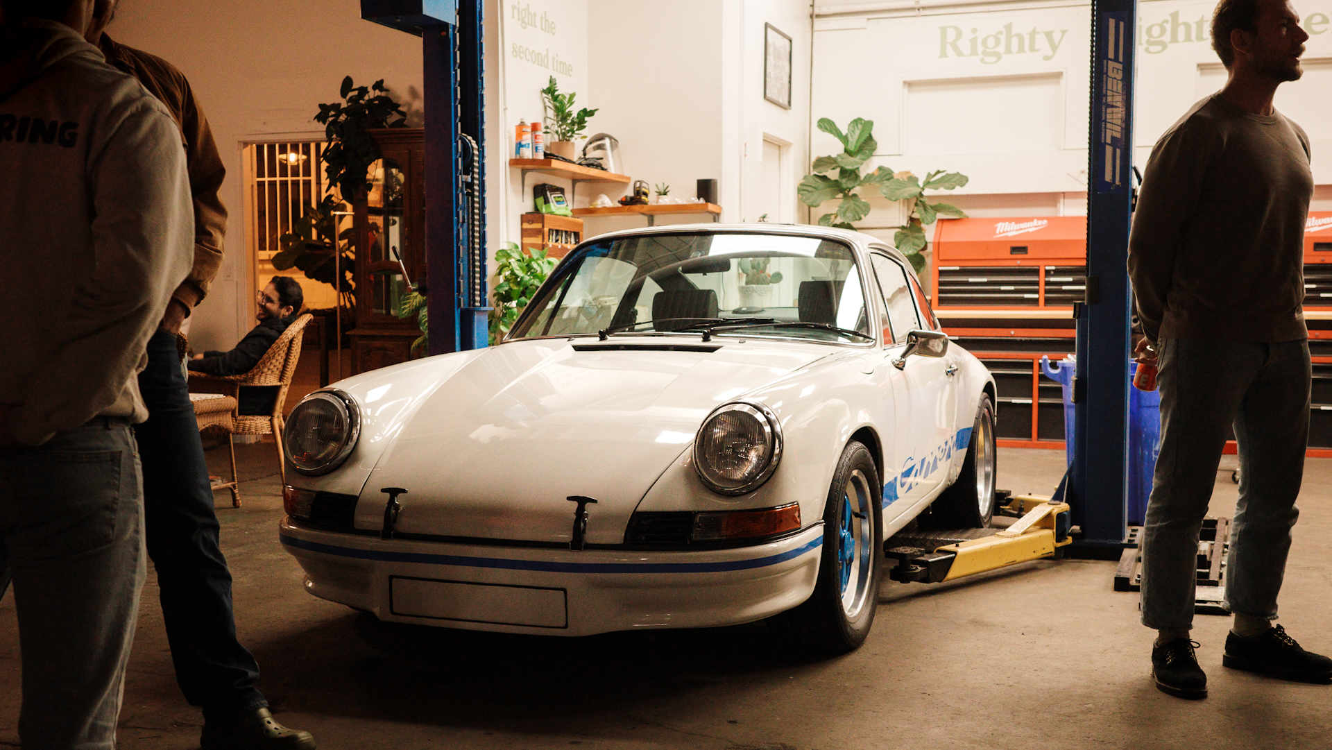 Porsche inside garage.