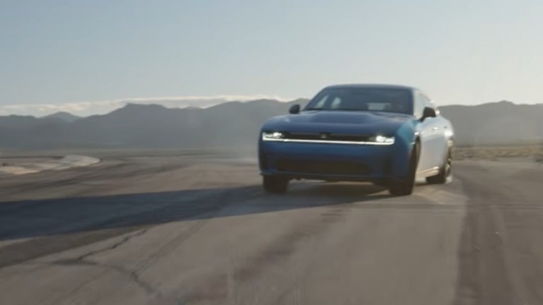 A blue Dodge Charger Daytona drifting.