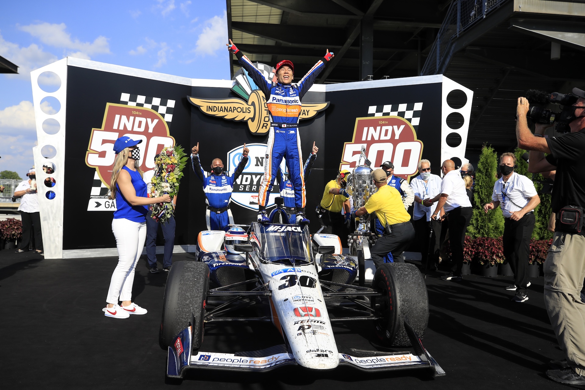 INDIANAPOLIS, INDIANA - AUGUST 23: Takuma Sato, driver of the #30 Panasonic / PeopleReady Rahal Letterman Lanigan Racing Honda, celebrates in Victory Lane after winning the 104th running of the Indianapolis 500 at Indianapolis Motor Speedway on August 23, 2020 in Indianapolis, Indiana. (Photo by Andy Lyons/Getty Images)