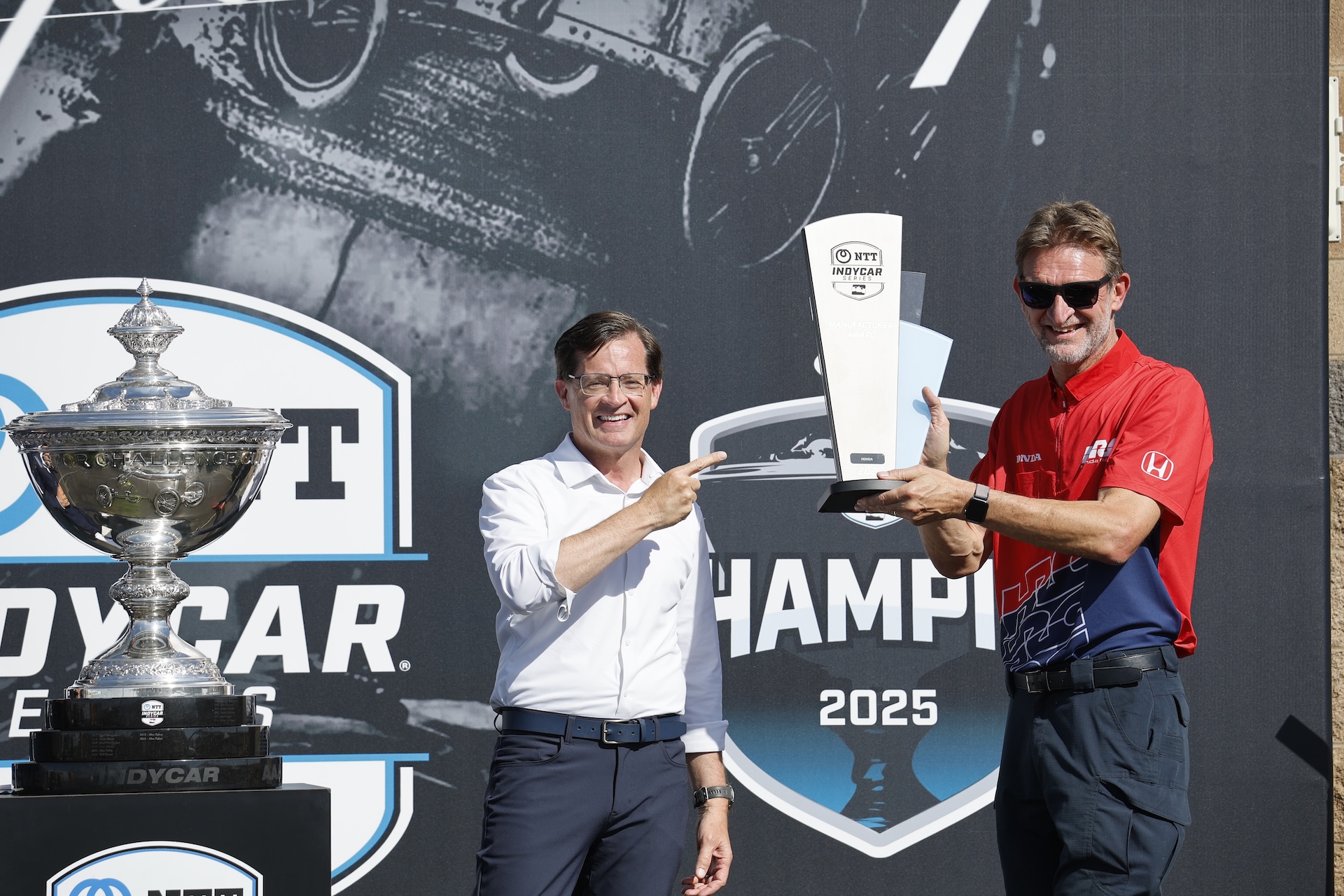LEBANON, TENNESSEE - AUGUST 31: IndyCar president Doug Boles presents the Manufacturers Trophy to Honda HRC President David Salters during the NTT INDYCAR Series Borchetta Bourbon Music City Grand Prix on August 31, 2025 in Lebanon, Tennessee. (Photo by Michael L. Levitt/Lumen via Getty Images)