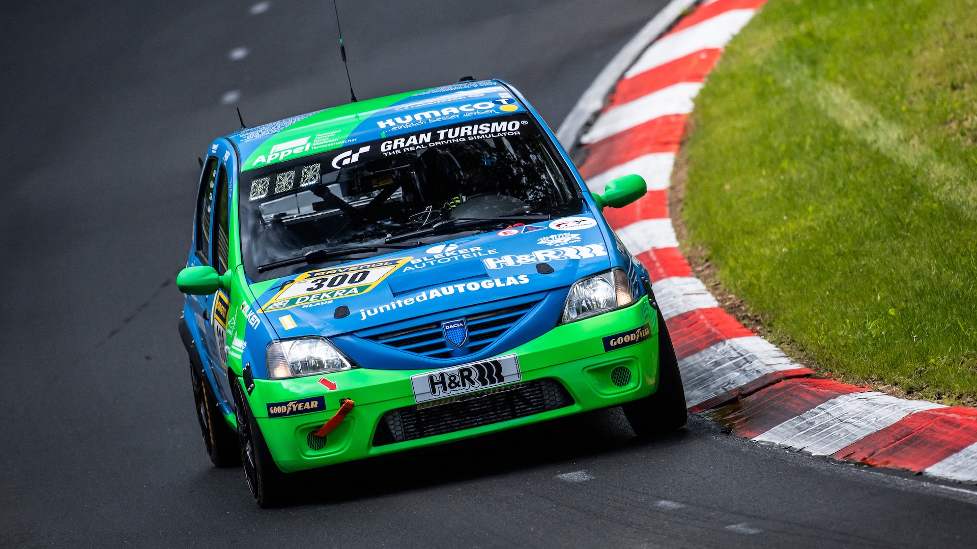 14 May 2026, Rhineland-Palatinate, Nürburg: The Dacia Logan with starting number 300 from the Ollis Garage Racing team with drivers Oliver Kriese, Christian Geilfus, Robert Neumann and Alexander Becker drives on the Nordschleife of the Nürburgring during Qualifying 1. Photo: Silas Stein/dpa (Photo by Silas Stein/picture alliance via Getty Images)