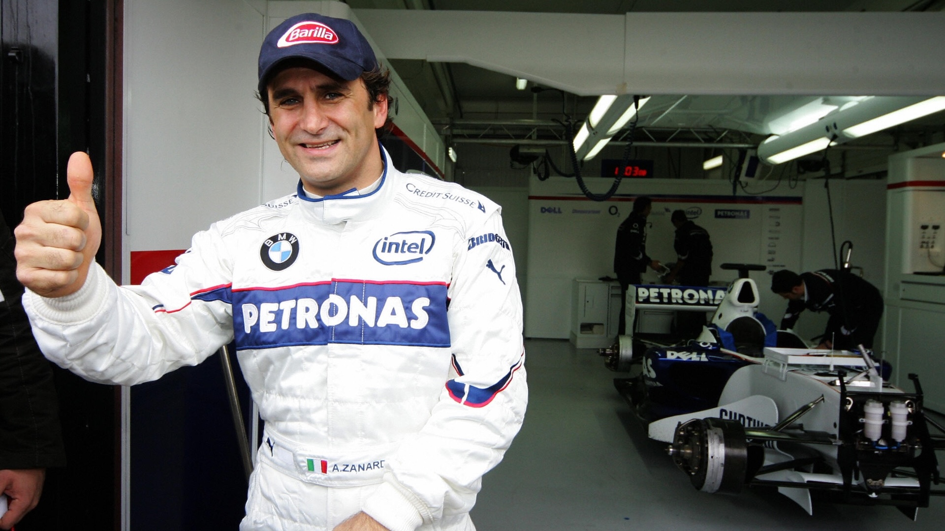 Cheste, SPAIN: Italian F1 driver Alex Zanardi who lost his both legs in an accident 15 September 2001 during a kart championships in Germany gestures after a BMW practice session at the racetrack Ricardo Tormo in Cheste near Valencia 25 November 2006. AFP PHOTO/JOSE JORDAN (Photo credit should read JOSE JORDAN/AFP via Getty Images)