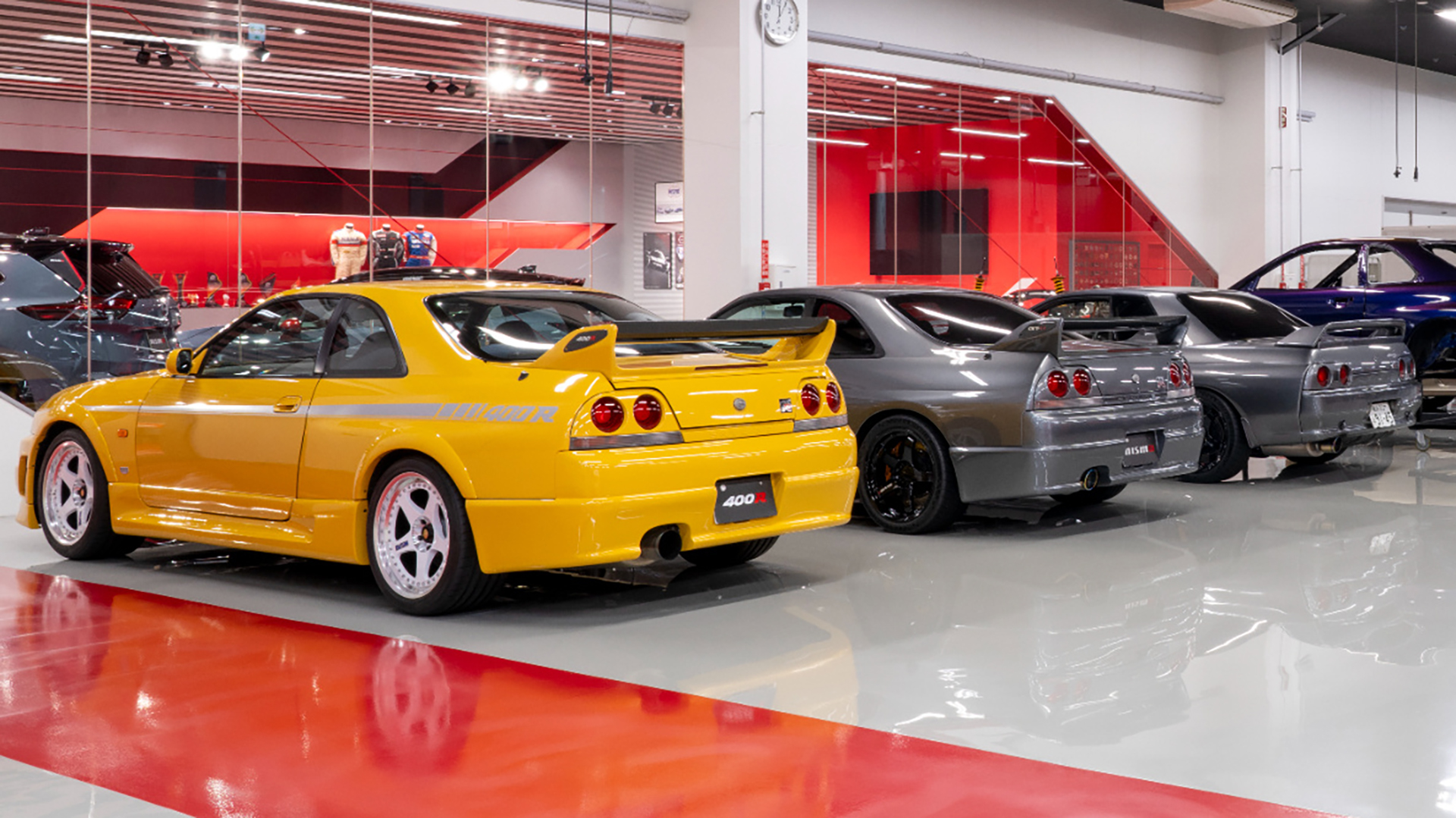 Nissan GT-Rs in a shop.
