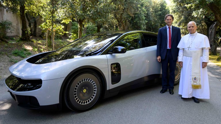Pope Leo XIV and Ferrari Chairman John Elkann pose beside the Ferrari Luce on May 26.