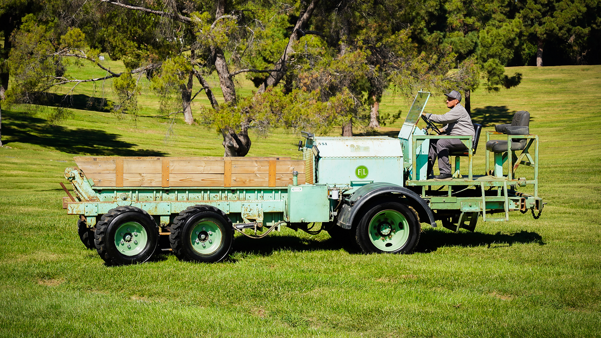 Eric Honore driving Forest Lawn cemetery vehicle.
