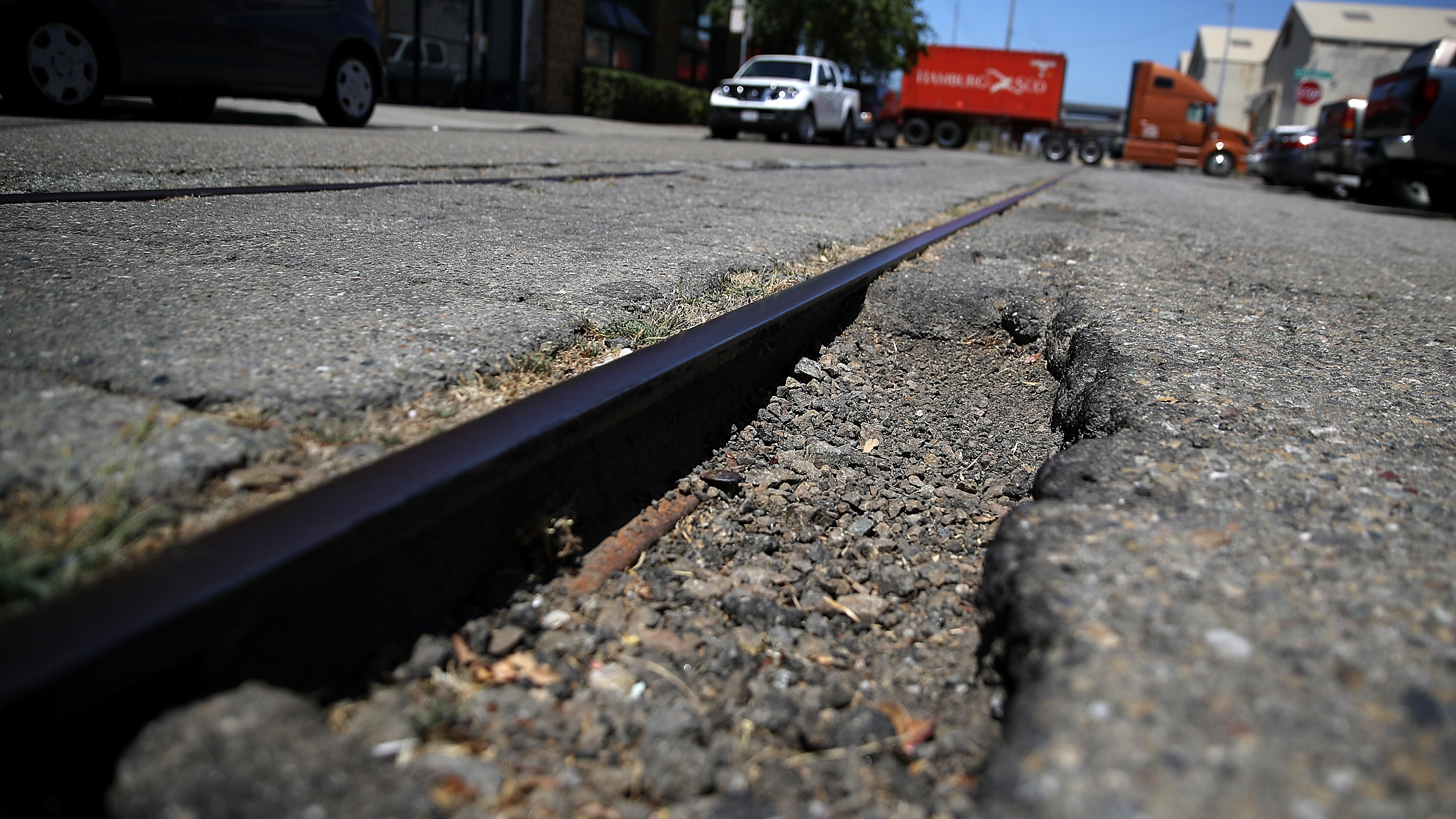 OAKLAND, CA - JULY 12: A large pothole is visible on 20th Street on July 12, 2017 in Oakland, California. According to a report by WalletHub, roads in San Francisco, Oakland and four other California cities are the worst in the United States. Drivers in San Francisco and Oakland pay an estimated $978 per year to repair vehicle damage from driving on roads with potholes and uneven pavement. (Photo by Justin Sullivan/Getty Images)