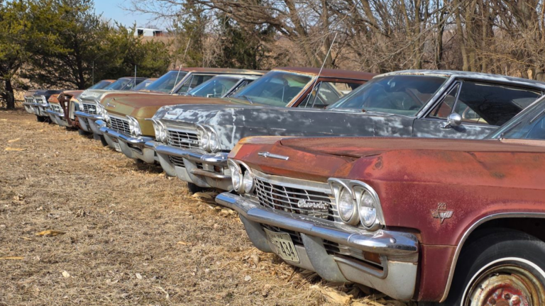 Line of Chevrolet Impalas in Nebraska field