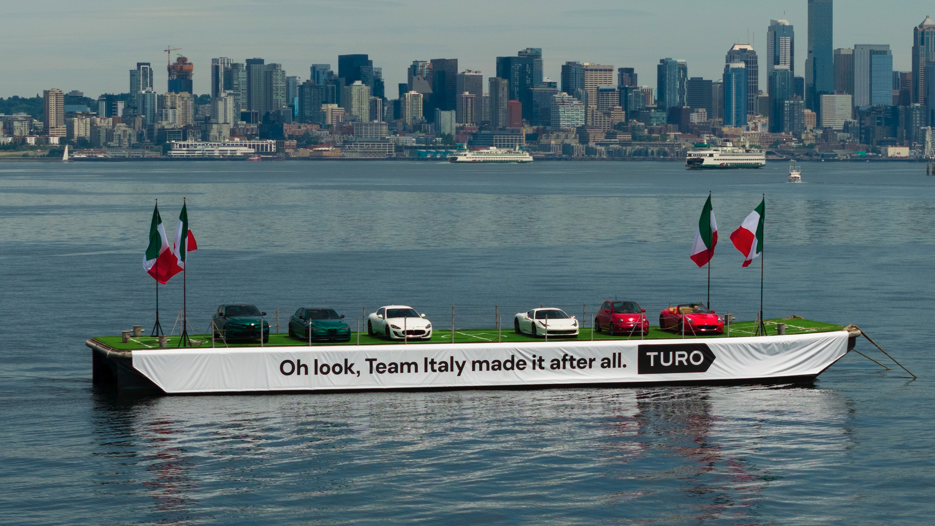 Italian cars on a boat.