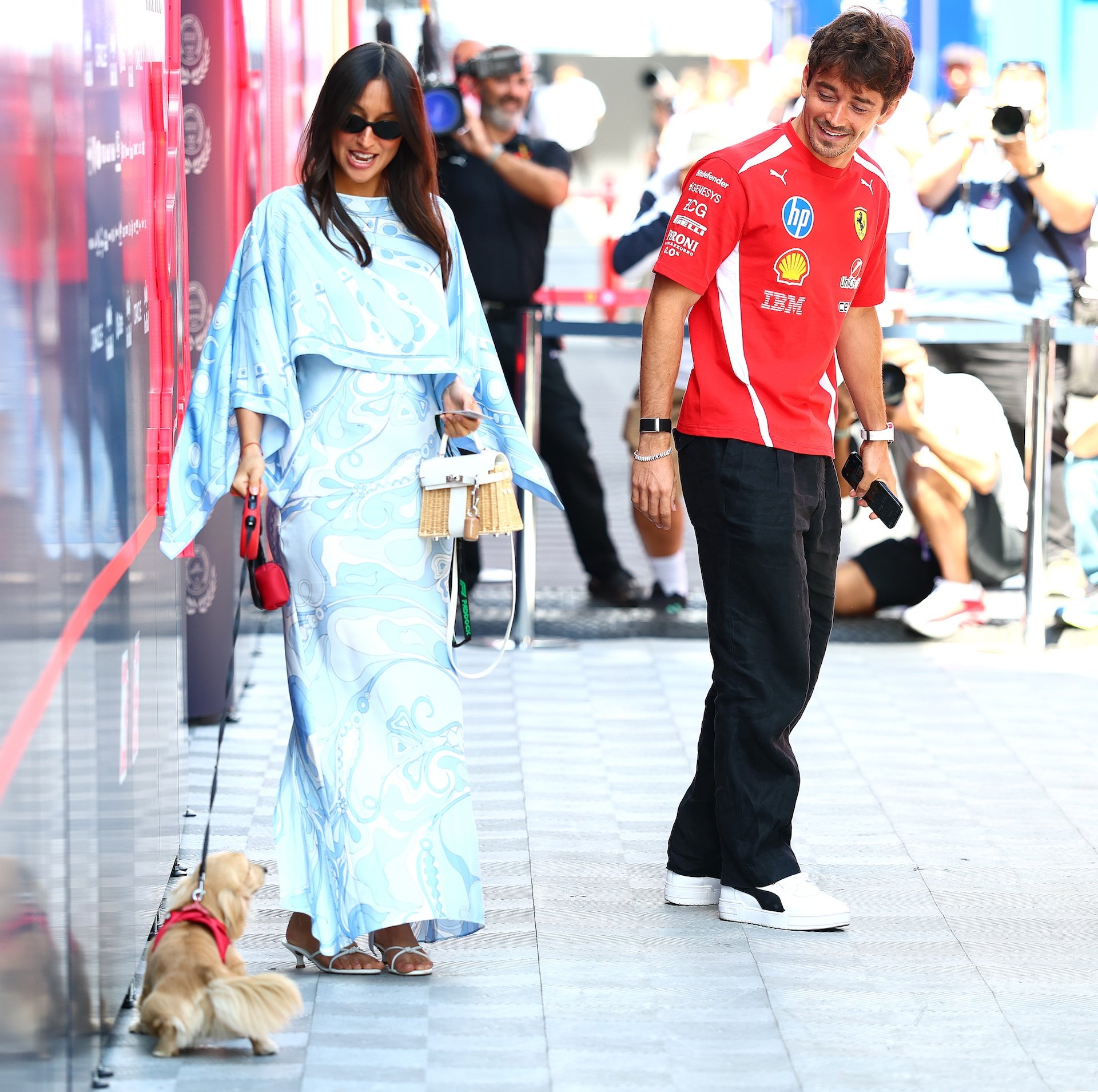 BUDAPEST, HUNGARY - JULY 24: Charles Leclerc of Monaco and Scuderia Ferrari and Alexandra Leclerc in the Paddock with Leo prior to practice ahead of the F1 Grand Prix of Hungary at Hungaroring on July 24, 2026 in Budapest, Hungary. (Photo by Clive Mason/Getty Images)