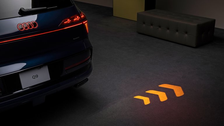 The 2027 Audi Q9's turn signal projection in action.