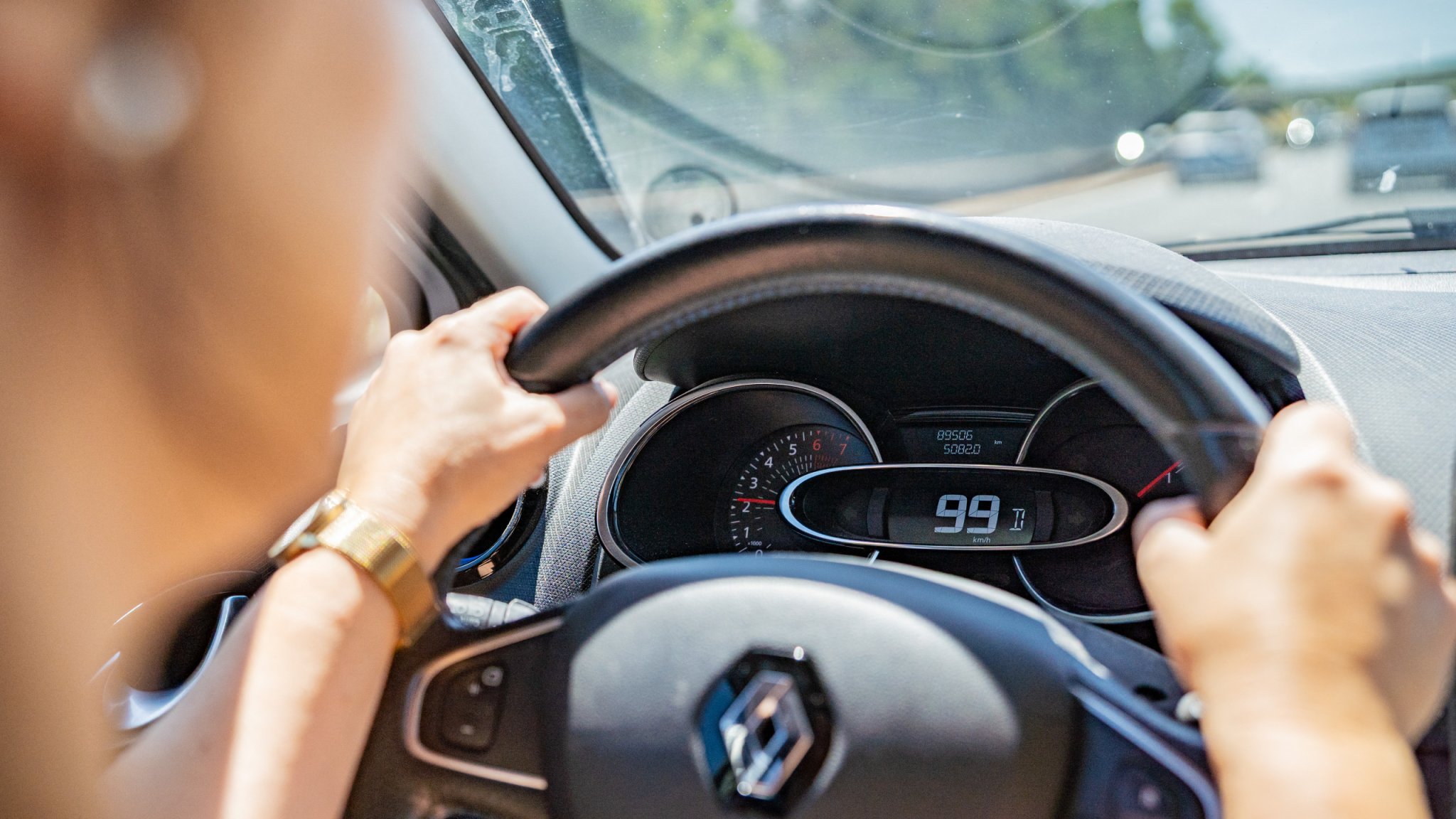 A woman drives a car on the highway with the speedometer showing the speed on July 5, 2025 in France.