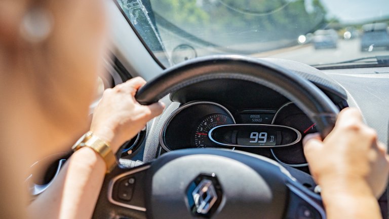 A woman drives a car on the highway with the speedometer showing the speed on July 5, 2025 in France.