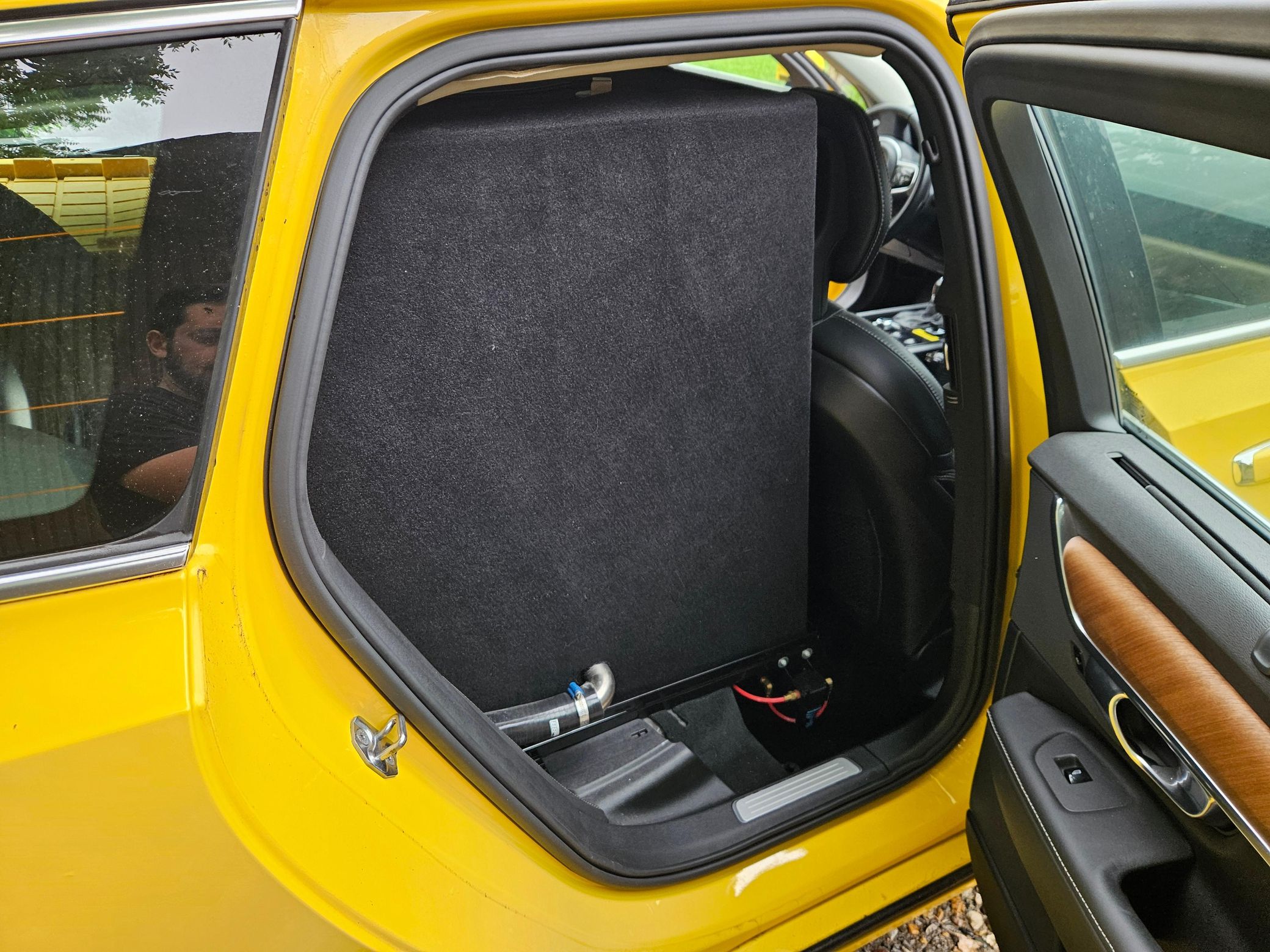 Yellow Volvo V90 with SARSYS airport runway friction testing equipment