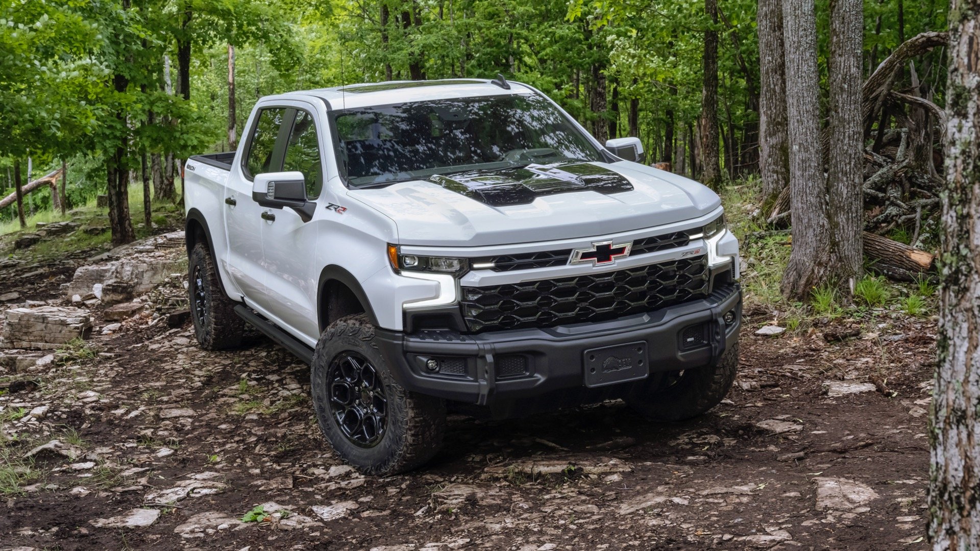 The 2024 Chevrolet Silverado ZR2 Bison on a wooded off-road trail