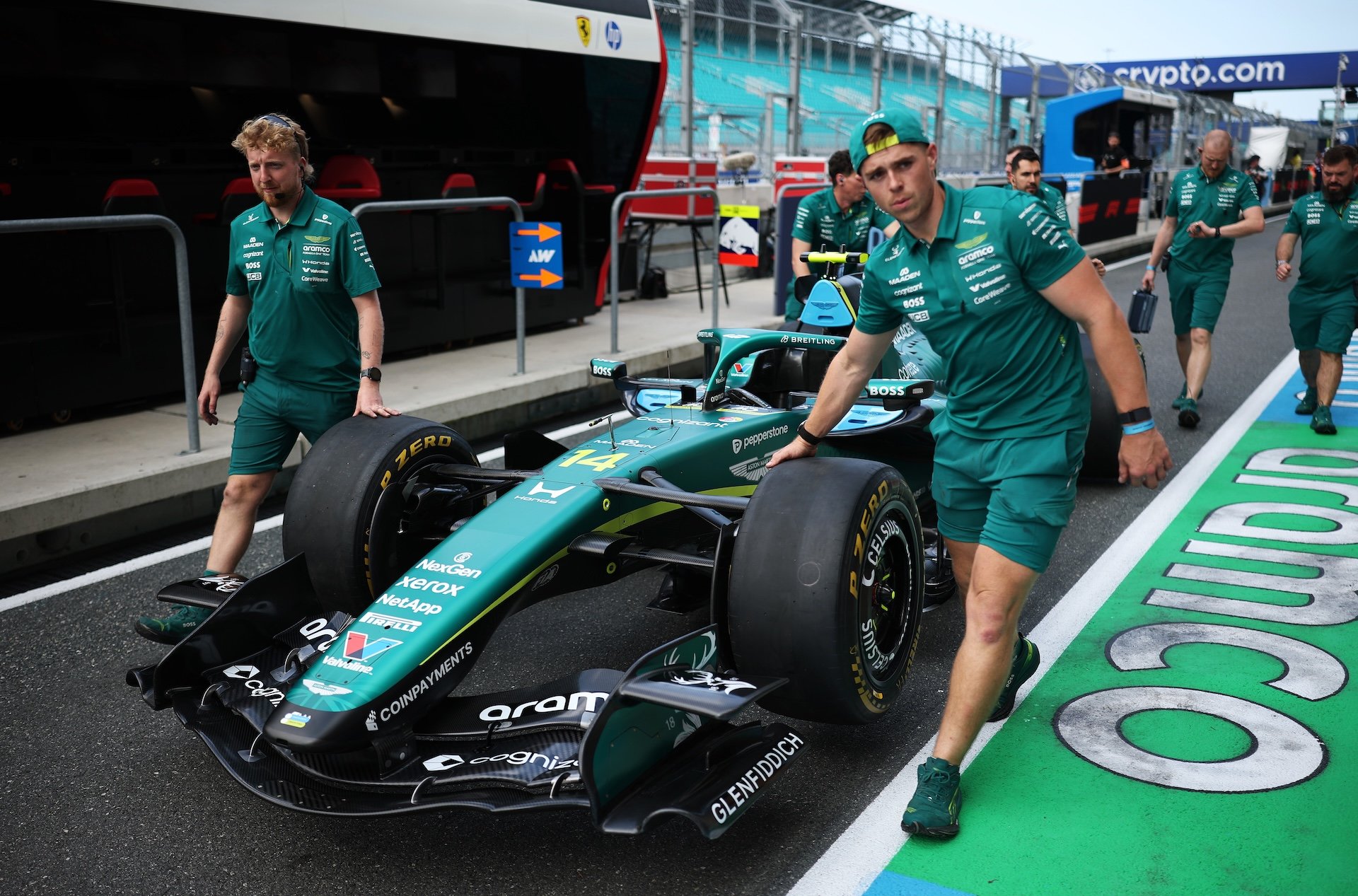 MIAMI, FLORIDA - APRIL 30: Mechanics push the (18) Aston Martin F1 Team AMR26 Honda through the pit lane during previews ahead of the F1 Grand Prix of Miami at Miami International Autodrome on April 30, 2026 in Miami, Florida. (Photo by Chris Graythen/Getty Images)