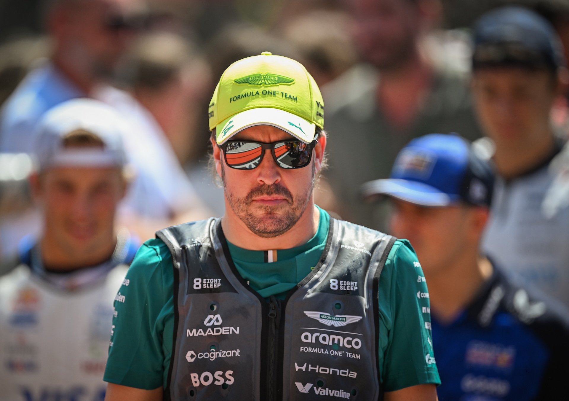 MOGYOROD, HUNGARY - JULY 26: Fernando Alonso of Spain looks on while wearing an Aston Martin Aramco F1 Team kit, cap, and sunglasses on the drivers' parade truck before the Formula 1 AWS Hungarian Grand Prix at the Hungaroring on July 26, 2026 in Mogyorod, Hungary. (Photo by Artur Widak/NurPhoto)