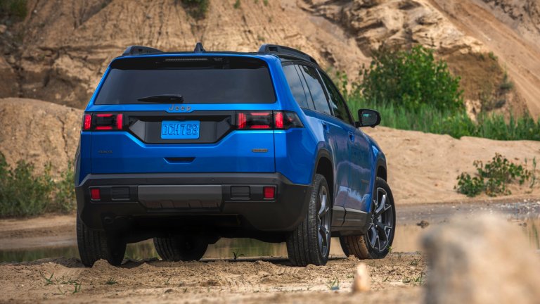 2026 Jeep Cherokee in blue, rear three quarters