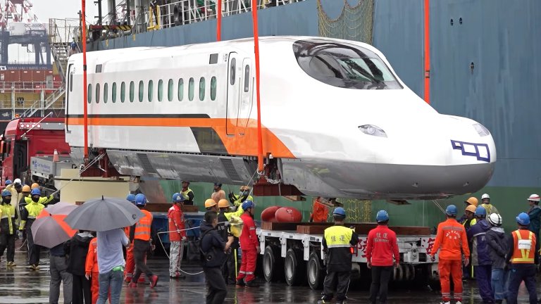 Shinkansen rail car being removed from cargo ship in Taiwan