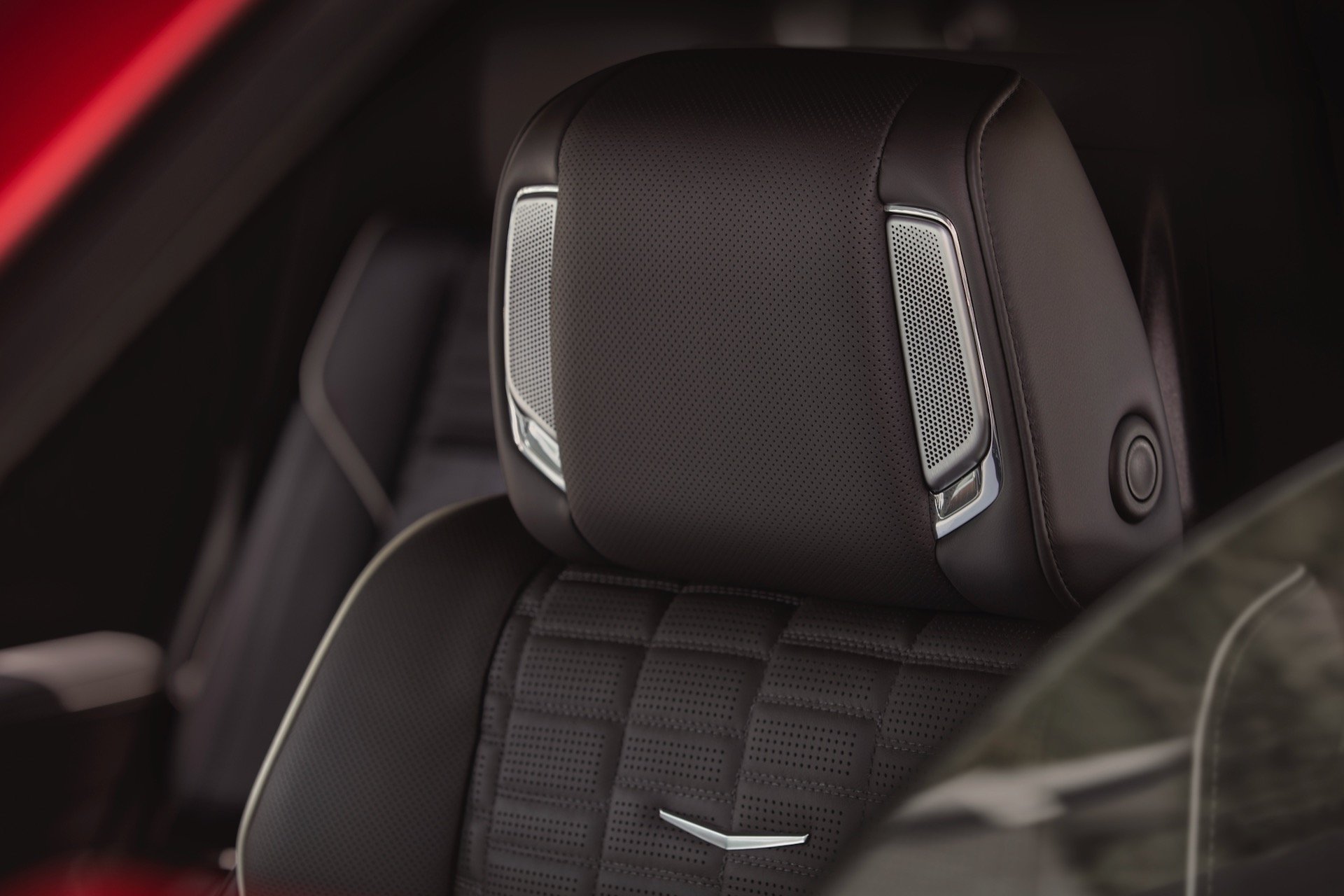 Close-up shot of the top of seat and headrest with AKG speakers in the 2025 Cadillac Escalade-V.