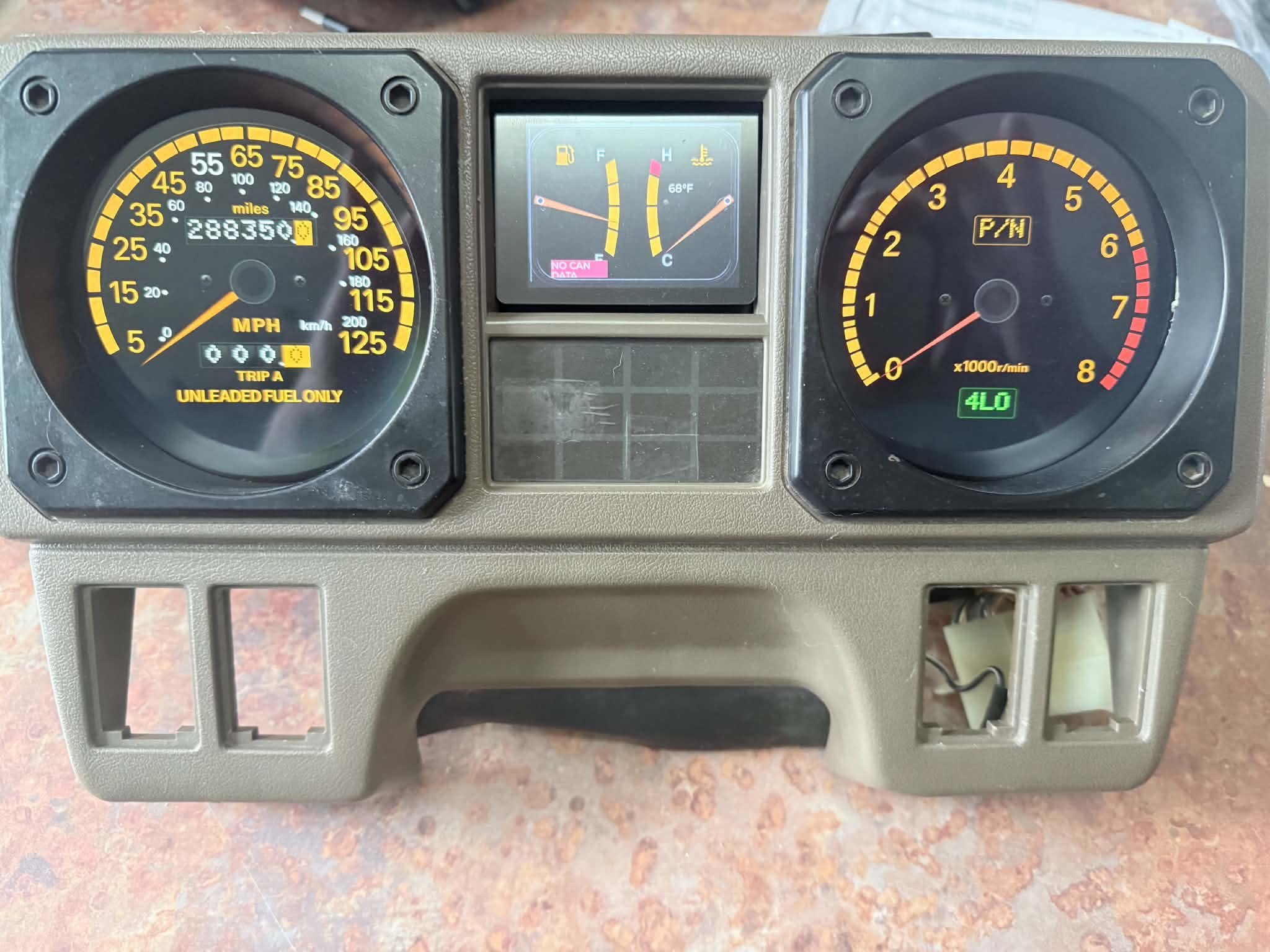 Custom digital gauges housed inside factory Mitsubishi Montero cluster