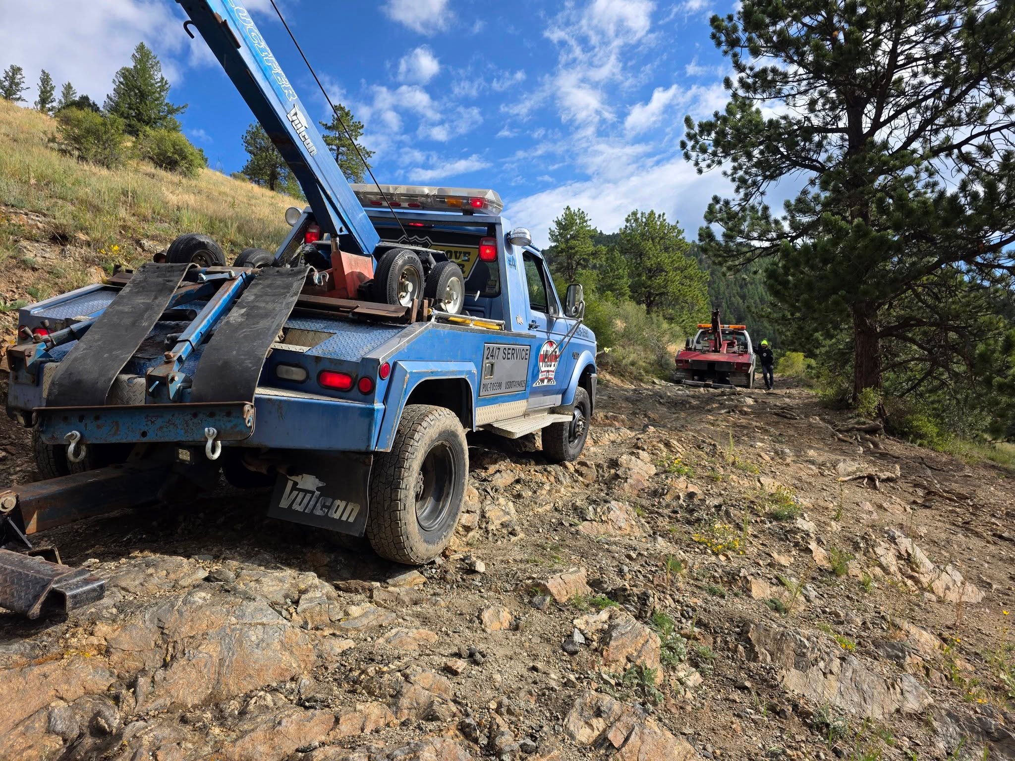 Milo's tow truck wrecked on mountainside