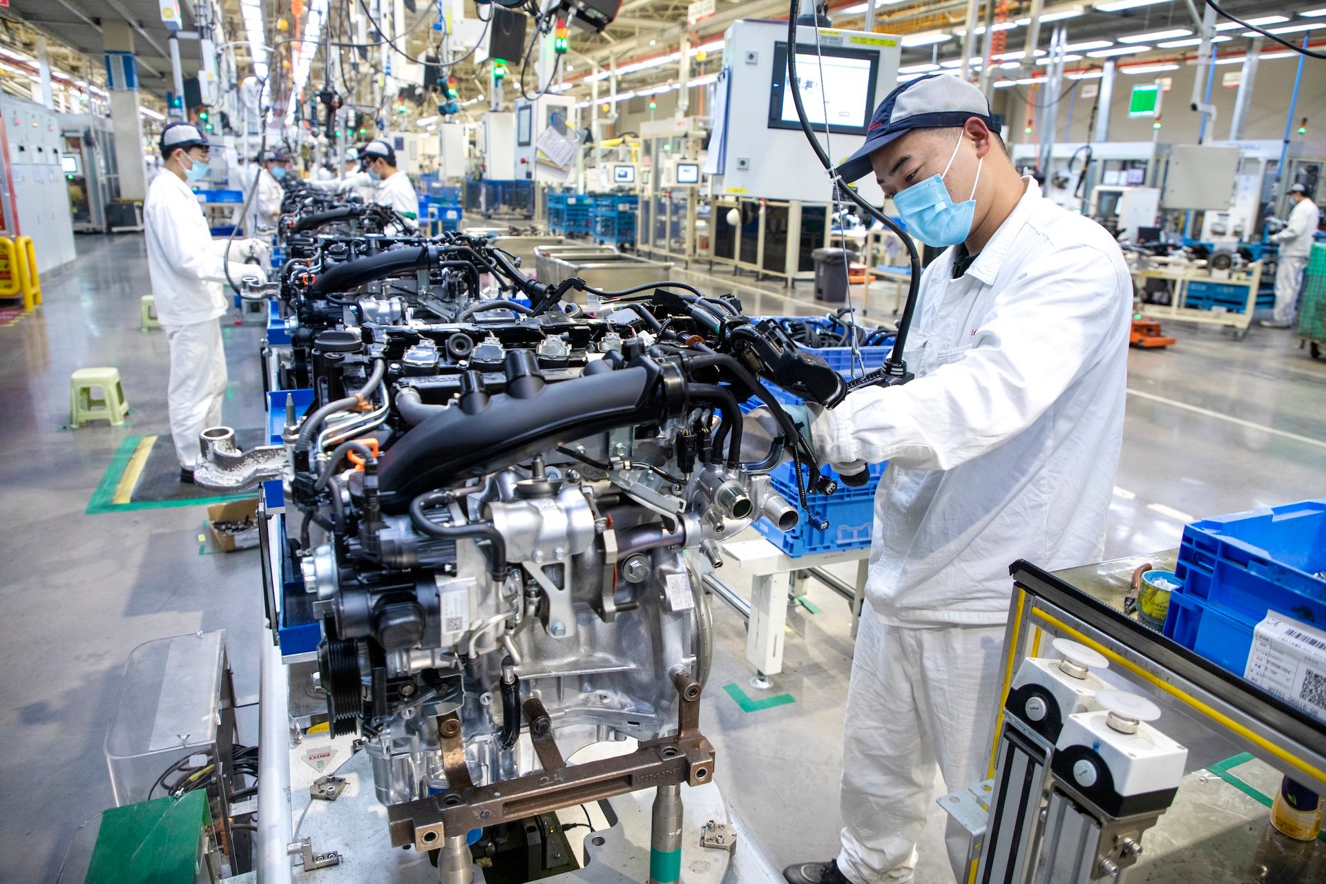 WUHAN, CHINA - APRIL 15: Employees work on the assembly line of Honda CR-V SUV at the third auto plant of Dongfeng Honda Automobile Co., Ltd on April 15, 2021 in Wuhan, Hubei Province of China. (Photo by Chen Zhuo/VCG via Getty Images)
