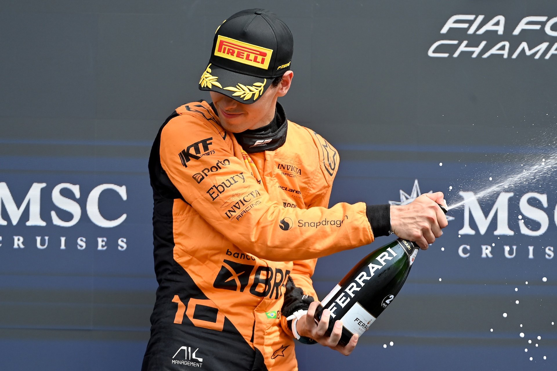 IMOLA, ITALY - MAY 19: Second placed Gabriel Bortoleto of Brazil and Invicta Racing (10) celebrates on the podium during the Round 4 Imola Feature race of the Formula 2 Championship at Autodromo Enzo e Dino Ferrari on May 19, 2024 in Imola, Italy. (Photo by James Sutton - Formula 1/Formula Motorsport Limited via Getty Images)