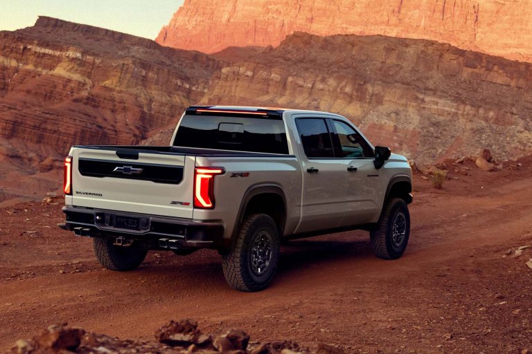 2027 Chevy Silverado ZR2 on a desert pass among giant rock formations