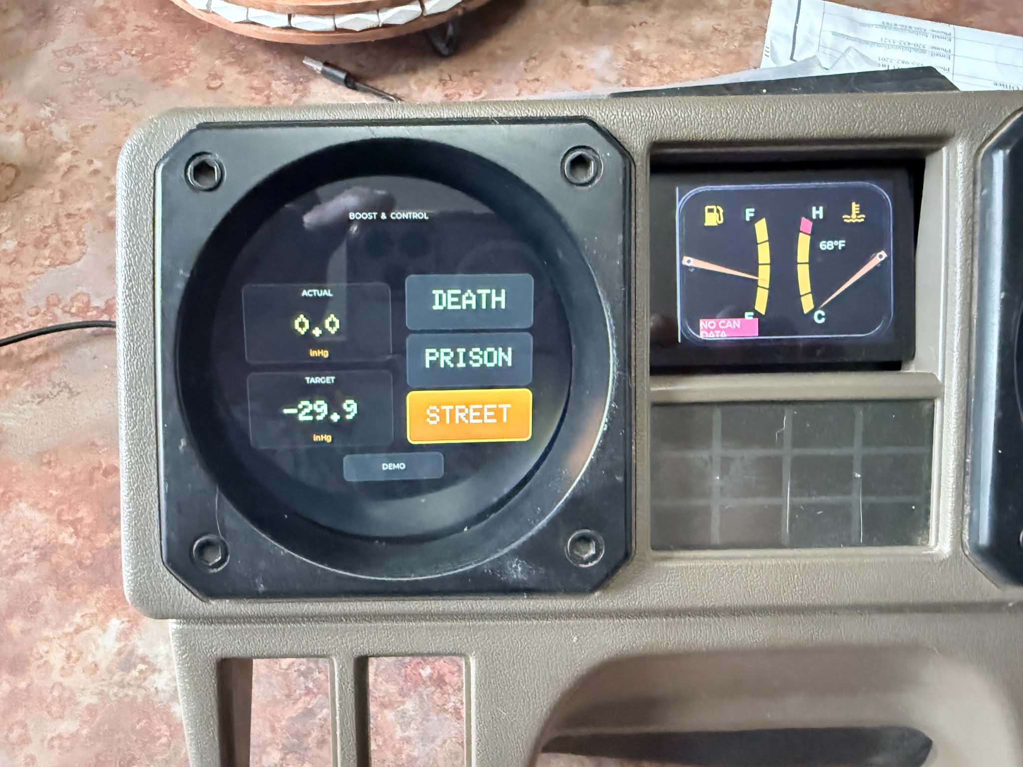 Custom digital gauges housed inside factory Mitsubishi Montero cluster