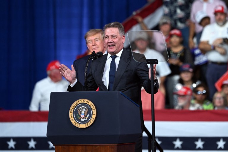 Audi CEO Gernot Döllner speaks alongside U.S. President Donald Trump during a midterm campaign rally in Perry, Georgia on Saturday.